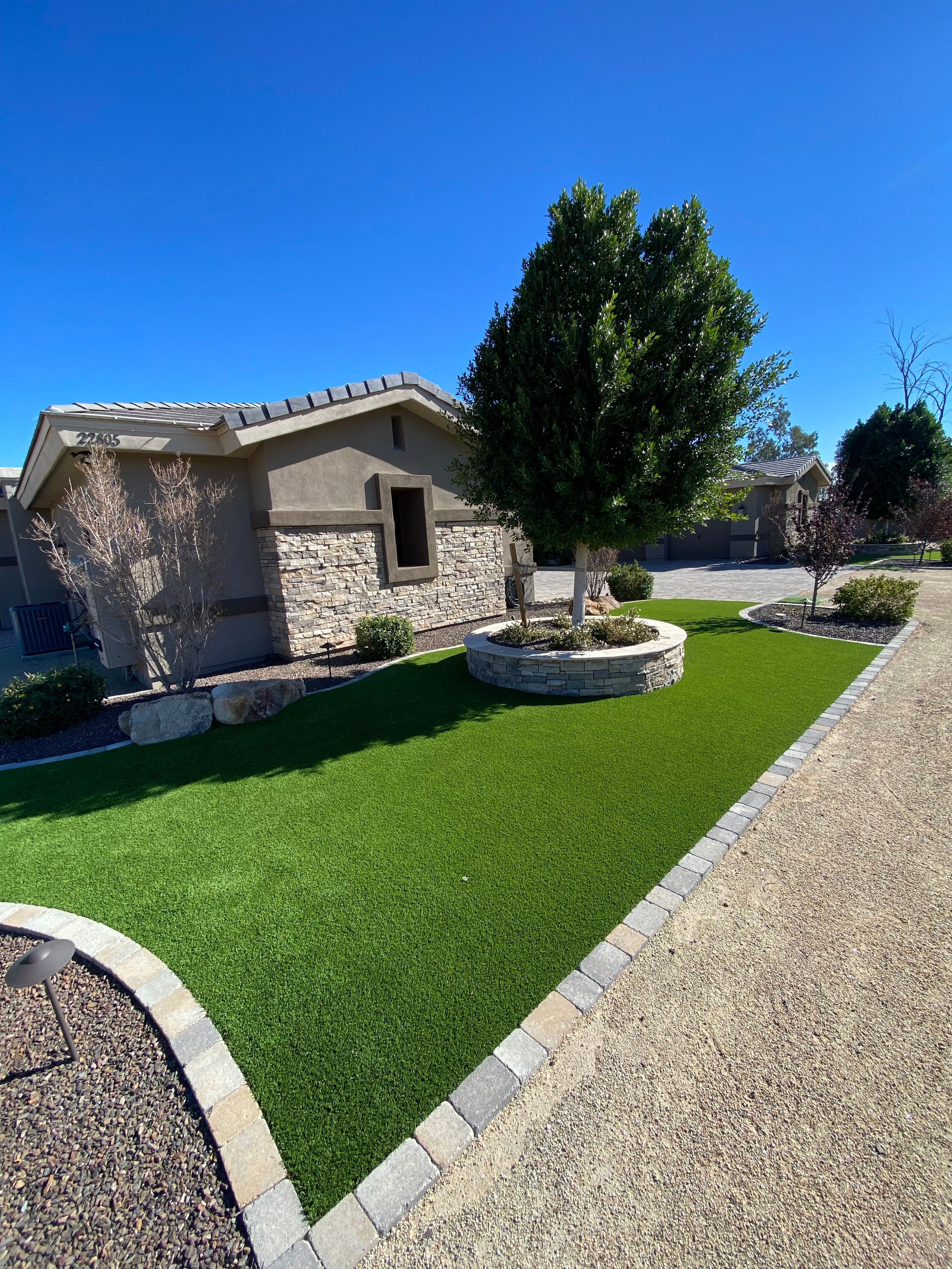 Front yard artificial turf professionally cleaned and maintained by Zeo Turf Cleaning